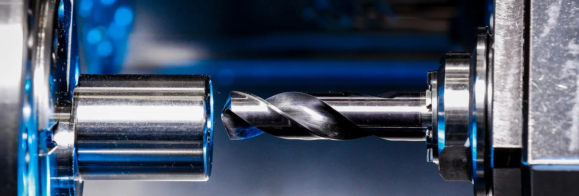 A drill bit in a machine during machining