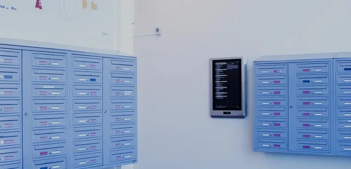 Mailboxes and an information screen in a stairwell